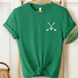 a green t - shirt with a crossed crossed crossed crossed crossed crossed crossed crossed crossed