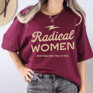 a woman wearing a red shirt that says radical women