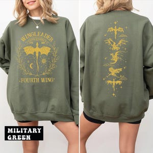 A woman wearing a green sweatshirt with a graphic design on the front and back.