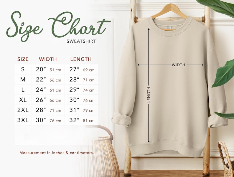 a size chart for a sweatshirt hanging on a wall