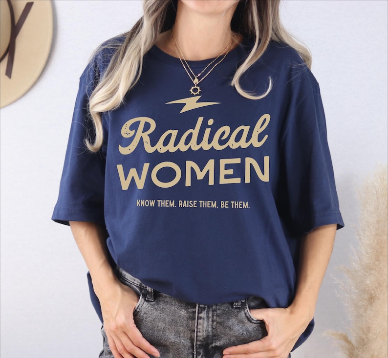a woman wearing a t - shirt that says radical women