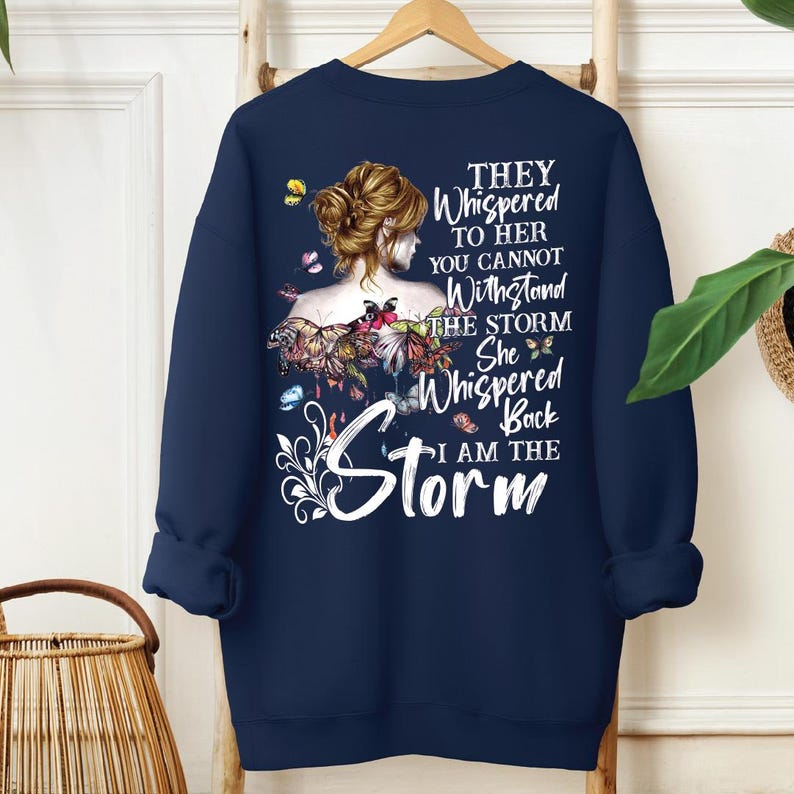 a blue sweatshirt with a picture of a woman's face on it