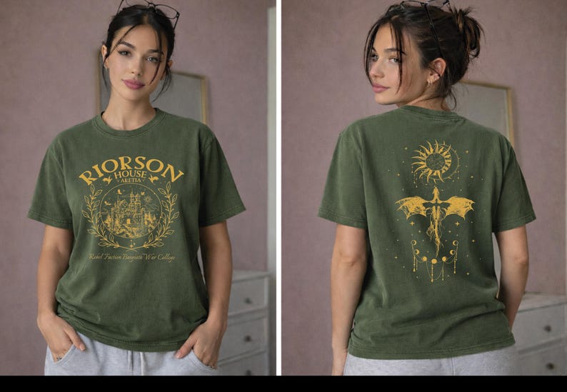 A woman wearing a green t-shirt with a graphic design on the front and back.