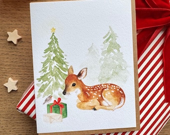 Tarjeta navideña con un cervatillo en acuarela - Tarjeta de felicitación - Cervatillo tumbado en un bosque con un petirrojo - Acuarela original - Tarjeta de felicitación hecha a mano