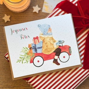 Carte de Noël aquarelle garçon sur camion rouge avec cadeaux, carte de souhait joyeuses fêtes, Carte de voeux faite à la main, joyeux Noël
