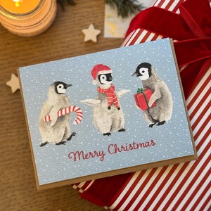 Carte de Noël pingouins aquarelle , carte de souhait, pingouins festifs mignons, Aquarelle Originale, Carte de voeux faite à la main