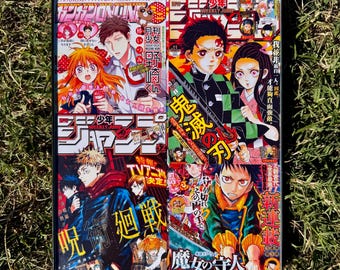 May include: A framed collage of Japanese manga magazine covers featuring characters from popular series like "Demon Slayer" and "Jujutsu Kaisen". The covers are in vibrant colors and feature action-packed scenes.