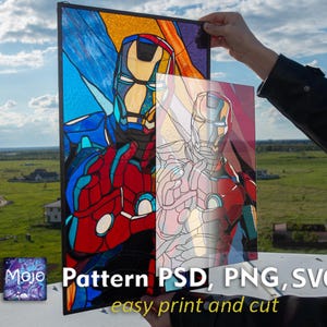 May include: A stained glass panel featuring Iron Man in a vibrant design with red, blue, and yellow hues. The panel is held up, showcasing the artwork against a background of a clear sky and green landscape. Text on the panel reads "Pattern PSD, PNG, SVG easy print and cut."
