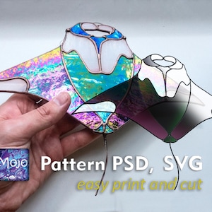 May include: A stained glass pattern in a unique shape, held by a hand. The design features iridescent glass with blue and white accents. Text on the image reads "Pattern PSD, SVG easy print and cut."