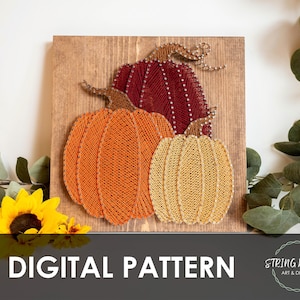 May include: String art pumpkins in orange, red, and yellow on a wooden background. The pumpkins are made with string and nails, and the artwork is displayed on a square wooden board. The words "DIGITAL PATTERN" are at the bottom.