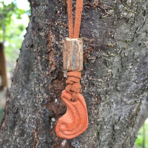 Pendant necklace from an ancient artifact. Medieval ceramics. Energy amulet of strength. Artifact. Place of power.