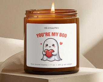 May include: A brown glass candle with a white label that says "HIGHS&LOWS YOU'RE MY BOO". The label features a cartoon ghost holding a red heart. The candle is hand-poured and weighs 7 ounces or 200 grams.
