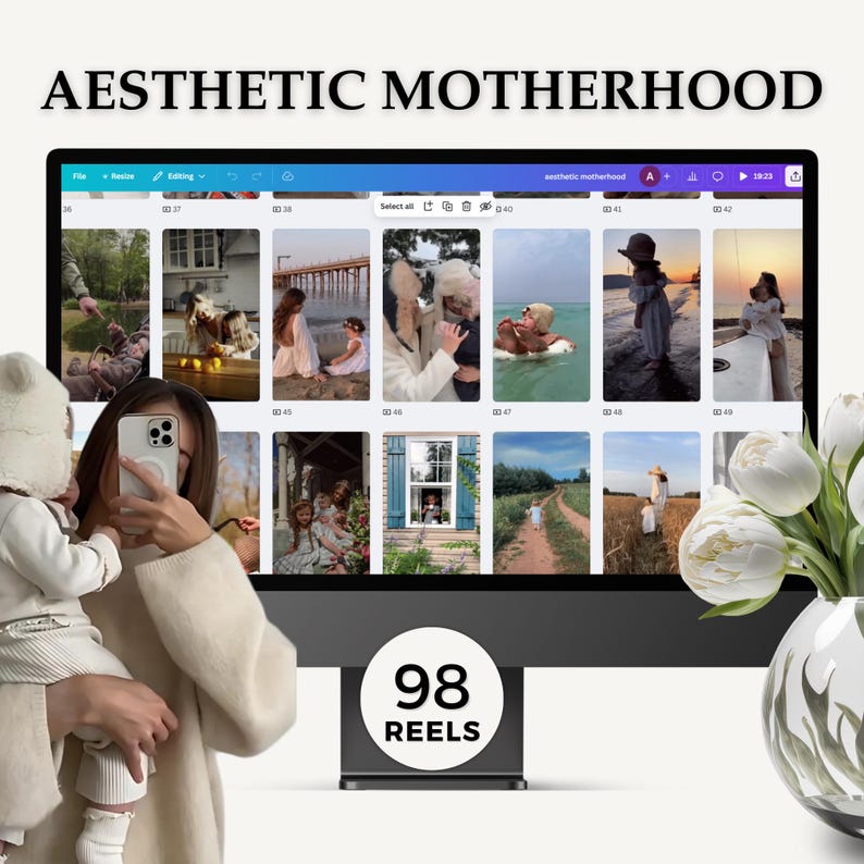 May include: A computer screen displaying a collection of 98 short videos titled "Aesthetic Motherhood". The videos are organized in a grid format and feature images of families, children, and nature. The screen is surrounded by a white background and a vase of white flowers.