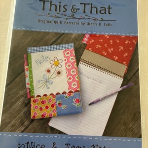 May include: A package featuring a quilted notebook and notepad. The notebook cover is patchwork with floral and gingham patterns, and the notepad has lined paper. The text "This & That" and "Nice & Easy Noteses" are visible.