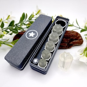 May include: A set of six clear, star-shaped silicone molds in a black box. The molds are arranged in a row and are all the same size. The box has a white star logo on the top.