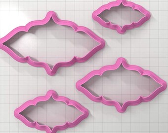 May include: Set of four pink plastic cookie cutters in the shape of a decorative frame. The cutters are different sizes.