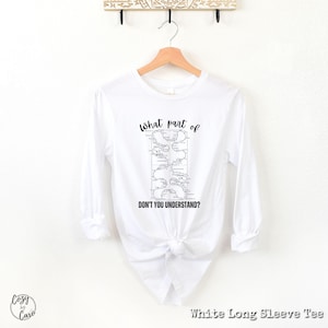 May include: White long-sleeve t-shirt with a black and white graphic of a map with the text "What part of don't you understand?"