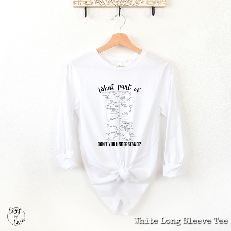 May include: White long-sleeve t-shirt with a black and white graphic of a map with the text "What part of don't you understand?"