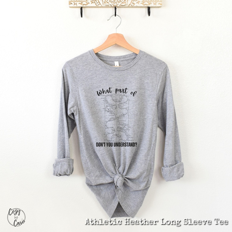 May include: Gray long-sleeve t-shirt with a black graphic of a map and the text "what part of DON'T YOU UNDERSTAND?"