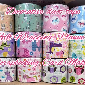 May include: A collection of decorative duct tape rolls with various patterns, including bunnies, horses, elephants, crocodiles, flamingos, unicorns, and owls. Text on the rolls reads "Decorative duct tape", "Gift Wrapping, Planners", and "Scrapbooking, Card Making."