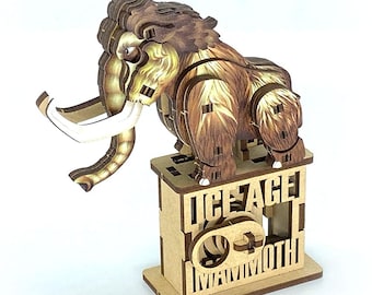 May include: A wooden 3D puzzle of a woolly mammoth. The mammoth is brown and tan with large white tusks. It stands on a wooden base with the words "ICE AGE MAMMOTH" cut out. The puzzle is designed to be assembled.