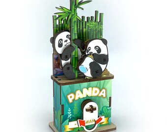 May include: A wooden panda-themed box with two panda figures and bamboo stalks. The box is green with the word "PANDA" on the front. One panda is holding a bottle. The box has a wooden base and a slot for inserting items.