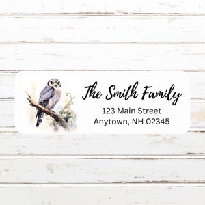 May include: A white return address label with a watercolor illustration of an owl perched on a branch. The text "The Smith Family" is written in a cursive font. The address is "123 Main Street, Anytown, NH 02345".