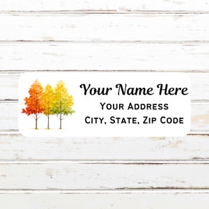 May include: White rectangular label with rounded corners featuring three watercolor trees in autumn colors. The label includes the text "Your Name Here", "Your Address", and "City, State, Zip Code".
