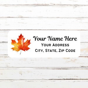 May include: A white label with an orange and yellow maple leaf illustration. The text "Your Name Here", "Your Address", and "City, State, Zip Code" is printed on the label.
