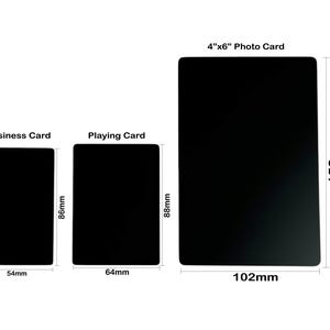 May include: A comparison of three different card sizes: a business card, a playing card, and a 4x6 inch photo card. The cards are black and the measurements are in millimeters.