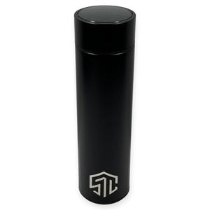 May include: A sleek, black insulated water bottle with a matte finish. The bottle has a black lid and a silver logo near the base. The cylindrical bottle is designed to keep beverages cold or hot. The overall design is modern and minimalist.