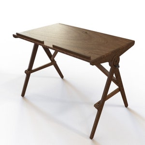 May include: A wooden desk with a fold-down top and a simple, rustic design. The desk has a dark brown finish and is supported by four legs.
