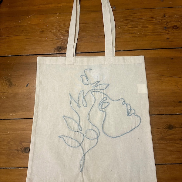 Hand-embroidered fabric bag / jute bag (Line Art - Face)