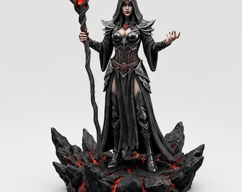 May include: A detailed figurine of a robed sorceress, holding a staff with a red orb. The figure is clad in black armor and a hooded cloak, standing on a rocky base with fiery red accents. The statue is approximately 12 inches tall.