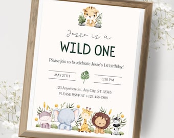 May include: A framed invitation with a jungle theme. The text reads "Jesse is a WILD ONE" and invites guests to a 1st birthday party. The invitation includes the date, time, and RSVP information. The design features a tiger, elephant, giraffe, lion, and zebra.
