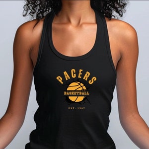 May include: Black tank top with a yellow graphic of a basketball with the text "PACERS BASKETBALL EST. 1967"