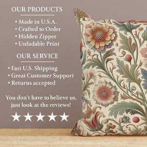 May include: A decorative throw pillow featuring a cream-colored background with a dense, intricate botanical pattern of large, multi-petaled flowers in shades of muted orange, dusty pink, and sage green, accented by curling leaves and stems.