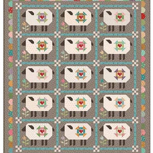 May include: A patchwork quilt featuring a repeating pattern of sheep. Each sheep has a heart-shaped design in the center. The quilt has a gray background with a blue border and floral accents. The quilt is a square shape.