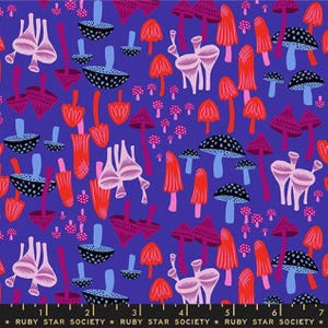 May include: A colourful fabric design with a repeating pattern of stylised mushrooms in red, pink, black, and white on a deep blue backdrop. The design features various mushroom shapes, creating a whimsical print. The text "RUBY STAR SOCIETY" is at the bottom.