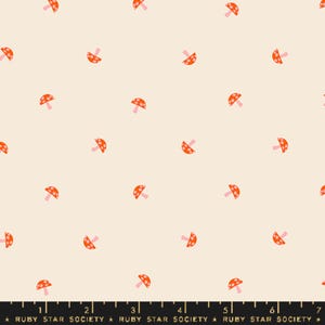 May include: A white fabric with a repeating pattern of orange and pink mushrooms. The mushrooms have white polka dots.