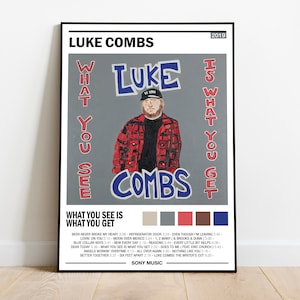 May include: A poster for Luke Combs' 2019 album "What You See Is What You Get". The poster features a photo of Luke Combs in a red and black plaid shirt, with the album title and tracklist printed below. The poster is designed in a minimalist style with a gray background and a color palette of gray, blue, red, and brown.