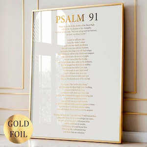 Puede incluir: Impresión enmarcada con lámina dorada del Salmo 91. El texto dorado sobre un fondo blanco. Las palabras "GOLD FOIL" están en un círculo dorado en la esquina inferior izquierda. El marco es dorado.