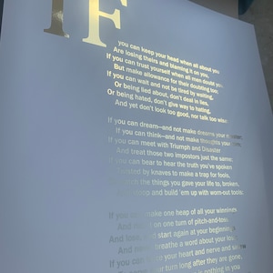 May include: A white print with gold foil text. The word "IF" is prominently displayed at the top, followed by a poem. The poem's text is in a serif font. The print is on a white background.