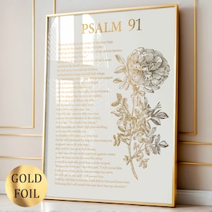 May include: A vertical wall art print in a gold frame featuring the text of Psalm 91 in gold foil lettering. To the right of the text is a detailed botanical illustration of a blooming rose with leaves and a stem, also rendered in gold foil.