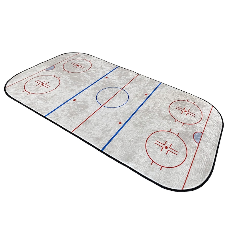 May include: A white and gray hockey rink rug with blue and red lines and circles. The rug has a black border.
