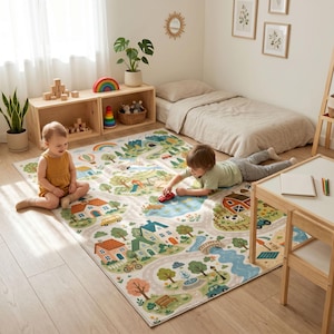 May include: A rectangular area rug featuring a colorful illustrated town map with roads, houses, trees, a pond, and a playground. The design includes a rainbow, a hot air balloon, and various vehicles printed on a light background for play.