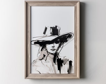 Op de afbeelding: Zwart-witte lijntekening van een vrouw met een brede hoed. De print is ingelijst in een licht houten lijst. De tekst "FLORA IN BLOOM CO." staat bovenaan de lijst.