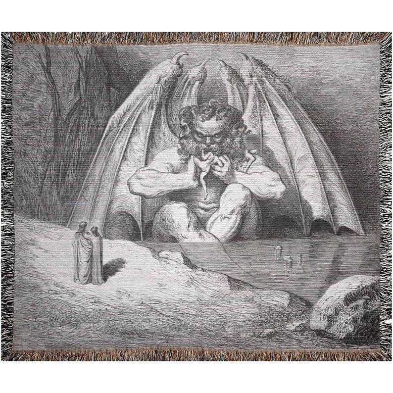 May include: A woven throw blanket featuring a detailed black and white illustration of a winged figure with a beard, eating a person. Two figures stand in the foreground. The blanket has a fringed edge.
