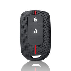 Puede incluir: Funda negra para llave de coche con un patrón texturizado en forma de panal. La funda tiene tres botones negros con iconos blancos y una raya roja. La funda está diseñada para proteger la llave del coche.