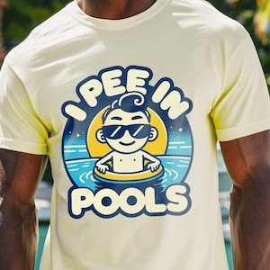 May include: A yellow t-shirt with a cartoon illustration of a person in a pool float. The text on the shirt reads "I pee in pools".